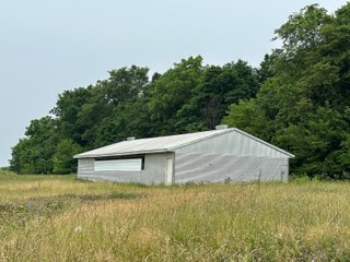 Don't miss this unique offering that includes a versatile mix of income-producing and recreational opportunities. Features include hog confinement buildings, three pole barns totaling 12,522 sq. ft. farm shop, a 1,456 sq. ft. home built in 2014, and wooded acreage. The property also includes nine lagoons-ideal for waterfowl hunting and wildlife habitat. Excellent potential for both livestock operation and hunting.<br><br>
<b>Tract 1:</b> 33.5+/-  Individual List price of $335,000. A waterfowl hunter's paradise with 7 ponds that were previous lagoons that have been cleaned and hold a heavy flow of ducks and geese. Consider the potential of stocking the ponds with fish as well. This tract also includes one confinement building that could be converted for numerous recreational uses.<br>
<b>Tract 2:</b> 16.5+/-  Individual List Price of $165,000 containing numerous outbuildings and confinement facilities. Consider the possibilities at hand with the immense amount of square footage available.<br>
<b>Tract 3:</b> 11+/-  Individual List Price of $275,000. Includes the 1,456 sq. ft. potential home and several outbuildings with wooded acreage.

 - RECREATIONAL LAND AND LIVESTOCK FACILITIES FOR SALE
