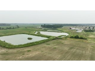 Don't miss this unique offering that includes a versatile mix of income-producing and recreational opportunities. Features include hog confinement buildings, three pole barns totaling 12,522 sq. ft. farm shop, a 1,456 sq. ft. home built in 2014, and wooded acreage. The property also includes nine lagoons-ideal for waterfowl hunting and wildlife habitat. Excellent potential for both livestock operation and hunting.<br><br>
<b>Tract 1:</b> 33.5+/-  Individual List price of $335,000. A waterfowl hunter's paradise with 7 ponds that were previous lagoons that have been cleaned and hold a heavy flow of ducks and geese. Consider the potential of stocking the ponds with fish as well. This tract also includes one confinement building that could be converted for numerous recreational uses.<br>
<b>Tract 2:</b> 16.5+/-  Individual List Price of $165,000 containing numerous outbuildings and confinement facilities. Consider the possibilities at hand with the immense amount of square footage available.<br>
<b>Tract 3:</b> 11+/-  Individual List Price of $275,000. Includes the 1,456 sq. ft. potential home and several outbuildings with wooded acreage.

 - RECREATIONAL LAND AND LIVESTOCK FACILITIES FOR SALE