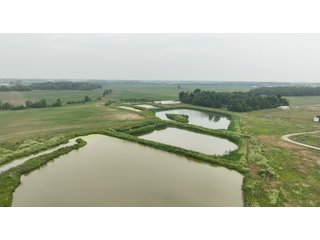 Don't miss this unique offering that includes a versatile mix of income-producing and recreational opportunities. Features include hog confinement buildings, three pole barns totaling 12,522 sq. ft. farm shop, a 1,456 sq. ft. home built in 2014, and wooded acreage. The property also includes nine lagoons-ideal for waterfowl hunting and wildlife habitat. Excellent potential for both livestock operation and hunting.<br><br>
<b>Tract 1:</b> 33.5+/-  Individual List price of $335,000. A waterfowl hunter's paradise with 7 ponds that were previous lagoons that have been cleaned and hold a heavy flow of ducks and geese. Consider the potential of stocking the ponds with fish as well. This tract also includes one confinement building that could be converted for numerous recreational uses.<br>
<b>Tract 2:</b> 16.5+/-  Individual List Price of $165,000 containing numerous outbuildings and confinement facilities. Consider the possibilities at hand with the immense amount of square footage available.<br>
<b>Tract 3:</b> 11+/-  Individual List Price of $275,000. Includes the 1,456 sq. ft. potential home and several outbuildings with wooded acreage.

 - RECREATIONAL LAND AND LIVESTOCK FACILITIES FOR SALE