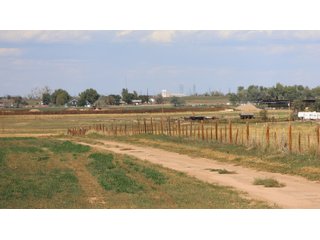 An opportunity to acquire approximately 280+/- acres along County Road 8 in southern Weld County. Strategically positioned between Fort Lupton and Brighton, the property consists of two contiguous parcels under common ownership and offers the scale and configuration to support agricultural operations, long-term investment, or future employment, industrial, technology and energy development.<BR><BR>
The property is presently zoned Agricultural in unincorporated Weld County. Its substantial acreage and location within the growing US Highway 85 and Interstate 76 corridor provide a strong foundation for a buyer prepared to evaluate zoning, infrastructure and development alternatives.<BR><BR>
Water interests include shares in the Wellington Reservoir Company, Burlington Ditch Reservoir and Land Company, and Brighton Lateral Ditch Company. Ownership, conveyance terms, historical use, transferable yield and suitability for future development remain subject to verification.<BR><BR>
The property provides access to the northern Denver metropolitan area, Denver International Airport and expanding Weld County employment centers. Existing agricultural use offers an interim holding strategy while a purchaser evaluates potential development plans and required approvals.<BR><BR>
Prospective purchasers should independently verify acreage, boundaries, access, zoning, permitted uses, utility availability and capacity, water rights, environmental conditions, mineral interests and development feasibility. No survey is being provided, and all future development concepts are subject to governmental and utility-provider approvals. - LAND FOR SALE - 280+/-ACRES IN WELD COUNTY, COLORADO