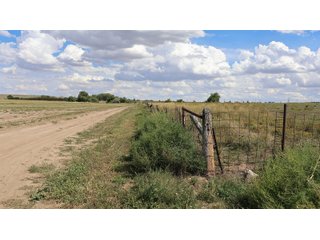 An opportunity to acquire approximately 280+/- acres along County Road 8 in southern Weld County. Strategically positioned between Fort Lupton and Brighton, the property consists of two contiguous parcels under common ownership and offers the scale and configuration to support agricultural operations, long-term investment, or future employment, industrial, technology and energy development.<BR><BR>
The property is presently zoned Agricultural in unincorporated Weld County. Its substantial acreage and location within the growing US Highway 85 and Interstate 76 corridor provide a strong foundation for a buyer prepared to evaluate zoning, infrastructure and development alternatives.<BR><BR>
Water interests include shares in the Wellington Reservoir Company, Burlington Ditch Reservoir and Land Company, and Brighton Lateral Ditch Company. Ownership, conveyance terms, historical use, transferable yield and suitability for future development remain subject to verification.<BR><BR>
The property provides access to the northern Denver metropolitan area, Denver International Airport and expanding Weld County employment centers. Existing agricultural use offers an interim holding strategy while a purchaser evaluates potential development plans and required approvals.<BR><BR>
Prospective purchasers should independently verify acreage, boundaries, access, zoning, permitted uses, utility availability and capacity, water rights, environmental conditions, mineral interests and development feasibility. No survey is being provided, and all future development concepts are subject to governmental and utility-provider approvals. - LAND FOR SALE - 280+/-ACRES IN WELD COUNTY, COLORADO