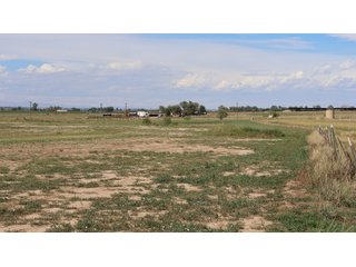 An opportunity to acquire approximately 280+/- acres along County Road 8 in southern Weld County. Strategically positioned between Fort Lupton and Brighton, the property consists of two contiguous parcels under common ownership and offers the scale and configuration to support agricultural operations, long-term investment, or future employment, industrial, technology and energy development.<BR><BR>
The property is presently zoned Agricultural in unincorporated Weld County. Its substantial acreage and location within the growing US Highway 85 and Interstate 76 corridor provide a strong foundation for a buyer prepared to evaluate zoning, infrastructure and development alternatives.<BR><BR>
Water interests include shares in the Wellington Reservoir Company, Burlington Ditch Reservoir and Land Company, and Brighton Lateral Ditch Company. Ownership, conveyance terms, historical use, transferable yield and suitability for future development remain subject to verification.<BR><BR>
The property provides access to the northern Denver metropolitan area, Denver International Airport and expanding Weld County employment centers. Existing agricultural use offers an interim holding strategy while a purchaser evaluates potential development plans and required approvals.<BR><BR>
Prospective purchasers should independently verify acreage, boundaries, access, zoning, permitted uses, utility availability and capacity, water rights, environmental conditions, mineral interests and development feasibility. No survey is being provided, and all future development concepts are subject to governmental and utility-provider approvals. - LAND FOR SALE - 280+/-ACRES IN WELD COUNTY, COLORADO