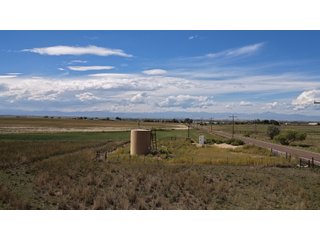 An opportunity to acquire approximately 280+/- acres along County Road 8 in southern Weld County. Strategically positioned between Fort Lupton and Brighton, the property consists of two contiguous parcels under common ownership and offers the scale and configuration to support agricultural operations, long-term investment, or future employment, industrial, technology and energy development.<BR><BR>
The property is presently zoned Agricultural in unincorporated Weld County. Its substantial acreage and location within the growing US Highway 85 and Interstate 76 corridor provide a strong foundation for a buyer prepared to evaluate zoning, infrastructure and development alternatives.<BR><BR>
Water interests include shares in the Wellington Reservoir Company, Burlington Ditch Reservoir and Land Company, and Brighton Lateral Ditch Company. Ownership, conveyance terms, historical use, transferable yield and suitability for future development remain subject to verification.<BR><BR>
The property provides access to the northern Denver metropolitan area, Denver International Airport and expanding Weld County employment centers. Existing agricultural use offers an interim holding strategy while a purchaser evaluates potential development plans and required approvals.<BR><BR>
Prospective purchasers should independently verify acreage, boundaries, access, zoning, permitted uses, utility availability and capacity, water rights, environmental conditions, mineral interests and development feasibility. No survey is being provided, and all future development concepts are subject to governmental and utility-provider approvals. - LAND FOR SALE - 280+/-ACRES IN WELD COUNTY, COLORADO