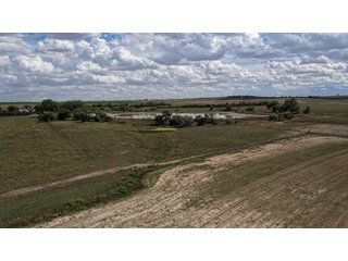 An opportunity to acquire approximately 280+/- acres along County Road 8 in southern Weld County. Strategically positioned between Fort Lupton and Brighton, the property consists of two contiguous parcels under common ownership and offers the scale and configuration to support agricultural operations, long-term investment, or future employment, industrial, technology and energy development.<BR><BR>
The property is presently zoned Agricultural in unincorporated Weld County. Its substantial acreage and location within the growing US Highway 85 and Interstate 76 corridor provide a strong foundation for a buyer prepared to evaluate zoning, infrastructure and development alternatives.<BR><BR>
Water interests include shares in the Wellington Reservoir Company, Burlington Ditch Reservoir and Land Company, and Brighton Lateral Ditch Company. Ownership, conveyance terms, historical use, transferable yield and suitability for future development remain subject to verification.<BR><BR>
The property provides access to the northern Denver metropolitan area, Denver International Airport and expanding Weld County employment centers. Existing agricultural use offers an interim holding strategy while a purchaser evaluates potential development plans and required approvals.<BR><BR>
Prospective purchasers should independently verify acreage, boundaries, access, zoning, permitted uses, utility availability and capacity, water rights, environmental conditions, mineral interests and development feasibility. No survey is being provided, and all future development concepts are subject to governmental and utility-provider approvals. - LAND FOR SALE - 280+/-ACRES IN WELD COUNTY, COLORADO