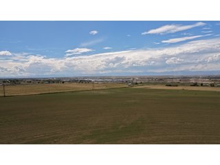 An opportunity to acquire approximately 280+/- acres along County Road 8 in southern Weld County. Strategically positioned between Fort Lupton and Brighton, the property consists of two contiguous parcels under common ownership and offers the scale and configuration to support agricultural operations, long-term investment, or future employment, industrial, technology and energy development.<BR><BR>
The property is presently zoned Agricultural in unincorporated Weld County. Its substantial acreage and location within the growing US Highway 85 and Interstate 76 corridor provide a strong foundation for a buyer prepared to evaluate zoning, infrastructure and development alternatives.<BR><BR>
Water interests include shares in the Wellington Reservoir Company, Burlington Ditch Reservoir and Land Company, and Brighton Lateral Ditch Company. Ownership, conveyance terms, historical use, transferable yield and suitability for future development remain subject to verification.<BR><BR>
The property provides access to the northern Denver metropolitan area, Denver International Airport and expanding Weld County employment centers. Existing agricultural use offers an interim holding strategy while a purchaser evaluates potential development plans and required approvals.<BR><BR>
Prospective purchasers should independently verify acreage, boundaries, access, zoning, permitted uses, utility availability and capacity, water rights, environmental conditions, mineral interests and development feasibility. No survey is being provided, and all future development concepts are subject to governmental and utility-provider approvals. - LAND FOR SALE - 280+/-ACRES IN WELD COUNTY, COLORADO