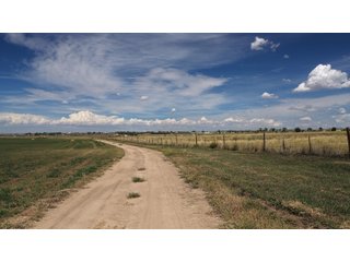 An opportunity to acquire approximately 280+/- acres along County Road 8 in southern Weld County. Strategically positioned between Fort Lupton and Brighton, the property consists of two contiguous parcels under common ownership and offers the scale and configuration to support agricultural operations, long-term investment, or future employment, industrial, technology and energy development.<BR><BR>
The property is presently zoned Agricultural in unincorporated Weld County. Its substantial acreage and location within the growing US Highway 85 and Interstate 76 corridor provide a strong foundation for a buyer prepared to evaluate zoning, infrastructure and development alternatives.<BR><BR>
Water interests include shares in the Wellington Reservoir Company, Burlington Ditch Reservoir and Land Company, and Brighton Lateral Ditch Company. Ownership, conveyance terms, historical use, transferable yield and suitability for future development remain subject to verification.<BR><BR>
The property provides access to the northern Denver metropolitan area, Denver International Airport and expanding Weld County employment centers. Existing agricultural use offers an interim holding strategy while a purchaser evaluates potential development plans and required approvals.<BR><BR>
Prospective purchasers should independently verify acreage, boundaries, access, zoning, permitted uses, utility availability and capacity, water rights, environmental conditions, mineral interests and development feasibility. No survey is being provided, and all future development concepts are subject to governmental and utility-provider approvals. - LAND FOR SALE - 280+/-ACRES IN WELD COUNTY, COLORADO