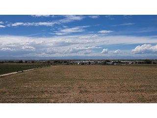 An opportunity to acquire approximately 280+/- acres along County Road 8 in southern Weld County. Strategically positioned between Fort Lupton and Brighton, the property consists of two contiguous parcels under common ownership and offers the scale and configuration to support agricultural operations, long-term investment, or future employment, industrial, technology and energy development.<BR><BR>
The property is presently zoned Agricultural in unincorporated Weld County. Its substantial acreage and location within the growing US Highway 85 and Interstate 76 corridor provide a strong foundation for a buyer prepared to evaluate zoning, infrastructure and development alternatives.<BR><BR>
Water interests include shares in the Wellington Reservoir Company, Burlington Ditch Reservoir and Land Company, and Brighton Lateral Ditch Company. Ownership, conveyance terms, historical use, transferable yield and suitability for future development remain subject to verification.<BR><BR>
The property provides access to the northern Denver metropolitan area, Denver International Airport and expanding Weld County employment centers. Existing agricultural use offers an interim holding strategy while a purchaser evaluates potential development plans and required approvals.<BR><BR>
Prospective purchasers should independently verify acreage, boundaries, access, zoning, permitted uses, utility availability and capacity, water rights, environmental conditions, mineral interests and development feasibility. No survey is being provided, and all future development concepts are subject to governmental and utility-provider approvals. - LAND FOR SALE - 280+/-ACRES IN WELD COUNTY, COLORADO