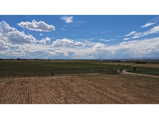 An opportunity to acquire approximately 280+/- acres along County Road 8 in southern Weld County. Strategically positioned between Fort Lupton and Brighton, the property consists of two contiguous parcels under common ownership and offers the scale and configuration to support agricultural operations, long-term investment, or future employment, industrial, technology and energy development.<BR><BR>
The property is presently zoned Agricultural in unincorporated Weld County. Its substantial acreage and location within the growing US Highway 85 and Interstate 76 corridor provide a strong foundation for a buyer prepared to evaluate zoning, infrastructure and development alternatives.<BR><BR>
Water interests include shares in the Wellington Reservoir Company, Burlington Ditch Reservoir and Land Company, and Brighton Lateral Ditch Company. Ownership, conveyance terms, historical use, transferable yield and suitability for future development remain subject to verification.<BR><BR>
The property provides access to the northern Denver metropolitan area, Denver International Airport and expanding Weld County employment centers. Existing agricultural use offers an interim holding strategy while a purchaser evaluates potential development plans and required approvals.<BR><BR>
Prospective purchasers should independently verify acreage, boundaries, access, zoning, permitted uses, utility availability and capacity, water rights, environmental conditions, mineral interests and development feasibility. No survey is being provided, and all future development concepts are subject to governmental and utility-provider approvals. - LAND FOR SALE - 280+/-ACRES IN WELD COUNTY, COLORADO