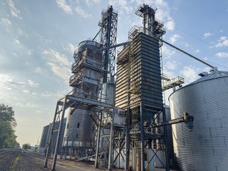 The Frick Grain and Agronomy site facilities are situated on approximately 35+/- acres and represent a rare, large-scale agribusiness operation ready for immediate use.<BR>
The grain system offers an impressive 1,660,000-bushel capacity across six bins. The tower grain dryer operates at 4,000 bu/hr at 5-point moisture removal, ensuring efficient drying capacity for high-volume harvests. The west grain facility features a grain leg capacity of 6,000 bu/hr, while the east grain facility boasts a robust 10,000 bu/hr grain leg capacity. Supporting the drying operation is an 8,000-bushel wet holding bin that feeds directly into the dryer, along with 12,000-bushel overhead load bins. The property also includes an 18,000-gallon LP tank to power operations.<br>
The agronomy infrastructure is equally impressive, featuring over 2,100,000 gallons of liquid fertilizer storage with a covered loadout facility for liquid products. A 500-ton dry fertilizer building with 8 bays provides ample space, complete with blending and loading equipment. The commercial chemical building houses 10 stainless steel tanks with over 30,000 gallons of bulk herbicide storage, equipped with a fully piped, computerized mixing system and covered loadout structure. Additional storage includes a 60' x 80' heated commercial shop building and a 50' x 90' storage building with a tote rack system for chemicals and seed.<br>
The facility enjoys direct access to the Norfolk Southern Railroad, with a large rail siding capable of receiving tanker cars and loading grain onto railcars. A dedicated piping system allows for the direct unloading of tanker cars into the two 1,000,000-gallon liquid tanks. Weighing operations are handled by a heavy-duty 120,000-pound capacity in-ground scale.<br>
As an added income stream, a telecommunications tower located on the west end of the property generates $9,268 in annual income, with an escalator clause providing year-over-year growth.<br>
Please refer to the improvement chart for dates and dimensions of all structures located on the facility.<br>
This is an extremely rare opportunity to acquire this level of grain handling and storage capacity, agronomy infrastructure, and overall square footage - all at a compelling price point. Don't miss your chance to own one of the most well-equipped agricultural facilities available on the market today! - GRAIN FACILITY FOR SALE - 35+/-ACRES IN NOBLE COUNTY, INDIANA