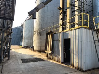 The Frick Grain and Agronomy site facilities are situated on approximately 35+/- acres and represent a rare, large-scale agribusiness operation ready for immediate use.<BR>
The grain system offers an impressive 1,660,000-bushel capacity across six bins. The tower grain dryer operates at 4,000 bu/hr at 5-point moisture removal, ensuring efficient drying capacity for high-volume harvests. The west grain facility features a grain leg capacity of 6,000 bu/hr, while the east grain facility boasts a robust 10,000 bu/hr grain leg capacity. Supporting the drying operation is an 8,000-bushel wet holding bin that feeds directly into the dryer, along with 12,000-bushel overhead load bins. The property also includes an 18,000-gallon LP tank to power operations.<br>
The agronomy infrastructure is equally impressive, featuring over 2,100,000 gallons of liquid fertilizer storage with a covered loadout facility for liquid products. A 500-ton dry fertilizer building with 8 bays provides ample space, complete with blending and loading equipment. The commercial chemical building houses 10 stainless steel tanks with over 30,000 gallons of bulk herbicide storage, equipped with a fully piped, computerized mixing system and covered loadout structure. Additional storage includes a 60' x 80' heated commercial shop building and a 50' x 90' storage building with a tote rack system for chemicals and seed.<br>
The facility enjoys direct access to the Norfolk Southern Railroad, with a large rail siding capable of receiving tanker cars and loading grain onto railcars. A dedicated piping system allows for the direct unloading of tanker cars into the two 1,000,000-gallon liquid tanks. Weighing operations are handled by a heavy-duty 120,000-pound capacity in-ground scale.<br>
As an added income stream, a telecommunications tower located on the west end of the property generates $9,268 in annual income, with an escalator clause providing year-over-year growth.<br>
Please refer to the improvement chart for dates and dimensions of all structures located on the facility.<br>
This is an extremely rare opportunity to acquire this level of grain handling and storage capacity, agronomy infrastructure, and overall square footage - all at a compelling price point. Don't miss your chance to own one of the most well-equipped agricultural facilities available on the market today! - GRAIN FACILITY FOR SALE - 35+/-ACRES IN NOBLE COUNTY, INDIANA