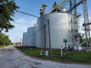 The Frick Grain and Agronomy site facilities are situated on approximately 35+/- acres and represent a rare, large-scale agribusiness operation ready for immediate use.<BR>
The grain system offers an impressive 1,660,000-bushel capacity across six bins. The tower grain dryer operates at 4,000 bu/hr at 5-point moisture removal, ensuring efficient drying capacity for high-volume harvests. The west grain facility features a grain leg capacity of 6,000 bu/hr, while the east grain facility boasts a robust 10,000 bu/hr grain leg capacity. Supporting the drying operation is an 8,000-bushel wet holding bin that feeds directly into the dryer, along with 12,000-bushel overhead load bins. The property also includes an 18,000-gallon LP tank to power operations.<br>
The agronomy infrastructure is equally impressive, featuring over 2,100,000 gallons of liquid fertilizer storage with a covered loadout facility for liquid products. A 500-ton dry fertilizer building with 8 bays provides ample space, complete with blending and loading equipment. The commercial chemical building houses 10 stainless steel tanks with over 30,000 gallons of bulk herbicide storage, equipped with a fully piped, computerized mixing system and covered loadout structure. Additional storage includes a 60' x 80' heated commercial shop building and a 50' x 90' storage building with a tote rack system for chemicals and seed.<br>
The facility enjoys direct access to the Norfolk Southern Railroad, with a large rail siding capable of receiving tanker cars and loading grain onto railcars. A dedicated piping system allows for the direct unloading of tanker cars into the two 1,000,000-gallon liquid tanks. Weighing operations are handled by a heavy-duty 120,000-pound capacity in-ground scale.<br>
As an added income stream, a telecommunications tower located on the west end of the property generates $9,268 in annual income, with an escalator clause providing year-over-year growth.<br>
Please refer to the improvement chart for dates and dimensions of all structures located on the facility.<br>
This is an extremely rare opportunity to acquire this level of grain handling and storage capacity, agronomy infrastructure, and overall square footage - all at a compelling price point. Don't miss your chance to own one of the most well-equipped agricultural facilities available on the market today! - GRAIN FACILITY FOR SALE - 35+/-ACRES IN NOBLE COUNTY, INDIANA