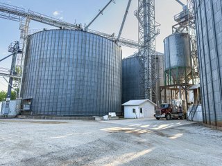 The Frick Grain and Agronomy site facilities are situated on approximately 35+/- acres and represent a rare, large-scale agribusiness operation ready for immediate use.<BR>
The grain system offers an impressive 1,660,000-bushel capacity across six bins. The tower grain dryer operates at 4,000 bu/hr at 5-point moisture removal, ensuring efficient drying capacity for high-volume harvests. The west grain facility features a grain leg capacity of 6,000 bu/hr, while the east grain facility boasts a robust 10,000 bu/hr grain leg capacity. Supporting the drying operation is an 8,000-bushel wet holding bin that feeds directly into the dryer, along with 12,000-bushel overhead load bins. The property also includes an 18,000-gallon LP tank to power operations.<br>
The agronomy infrastructure is equally impressive, featuring over 2,100,000 gallons of liquid fertilizer storage with a covered loadout facility for liquid products. A 500-ton dry fertilizer building with 8 bays provides ample space, complete with blending and loading equipment. The commercial chemical building houses 10 stainless steel tanks with over 30,000 gallons of bulk herbicide storage, equipped with a fully piped, computerized mixing system and covered loadout structure. Additional storage includes a 60' x 80' heated commercial shop building and a 50' x 90' storage building with a tote rack system for chemicals and seed.<br>
The facility enjoys direct access to the Norfolk Southern Railroad, with a large rail siding capable of receiving tanker cars and loading grain onto railcars. A dedicated piping system allows for the direct unloading of tanker cars into the two 1,000,000-gallon liquid tanks. Weighing operations are handled by a heavy-duty 120,000-pound capacity in-ground scale.<br>
As an added income stream, a telecommunications tower located on the west end of the property generates $9,268 in annual income, with an escalator clause providing year-over-year growth.<br>
Please refer to the improvement chart for dates and dimensions of all structures located on the facility.<br>
This is an extremely rare opportunity to acquire this level of grain handling and storage capacity, agronomy infrastructure, and overall square footage - all at a compelling price point. Don't miss your chance to own one of the most well-equipped agricultural facilities available on the market today! - GRAIN FACILITY FOR SALE - 35+/-ACRES IN NOBLE COUNTY, INDIANA