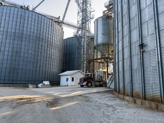 The Frick Grain and Agronomy site facilities are situated on approximately 35+/- acres and represent a rare, large-scale agribusiness operation ready for immediate use.<BR>
The grain system offers an impressive 1,660,000-bushel capacity across six bins. The tower grain dryer operates at 4,000 bu/hr at 5-point moisture removal, ensuring efficient drying capacity for high-volume harvests. The west grain facility features a grain leg capacity of 6,000 bu/hr, while the east grain facility boasts a robust 10,000 bu/hr grain leg capacity. Supporting the drying operation is an 8,000-bushel wet holding bin that feeds directly into the dryer, along with 12,000-bushel overhead load bins. The property also includes an 18,000-gallon LP tank to power operations.<br>
The agronomy infrastructure is equally impressive, featuring over 2,100,000 gallons of liquid fertilizer storage with a covered loadout facility for liquid products. A 500-ton dry fertilizer building with 8 bays provides ample space, complete with blending and loading equipment. The commercial chemical building houses 10 stainless steel tanks with over 30,000 gallons of bulk herbicide storage, equipped with a fully piped, computerized mixing system and covered loadout structure. Additional storage includes a 60' x 80' heated commercial shop building and a 50' x 90' storage building with a tote rack system for chemicals and seed.<br>
The facility enjoys direct access to the Norfolk Southern Railroad, with a large rail siding capable of receiving tanker cars and loading grain onto railcars. A dedicated piping system allows for the direct unloading of tanker cars into the two 1,000,000-gallon liquid tanks. Weighing operations are handled by a heavy-duty 120,000-pound capacity in-ground scale.<br>
As an added income stream, a telecommunications tower located on the west end of the property generates $9,268 in annual income, with an escalator clause providing year-over-year growth.<br>
Please refer to the improvement chart for dates and dimensions of all structures located on the facility.<br>
This is an extremely rare opportunity to acquire this level of grain handling and storage capacity, agronomy infrastructure, and overall square footage - all at a compelling price point. Don't miss your chance to own one of the most well-equipped agricultural facilities available on the market today! - GRAIN FACILITY FOR SALE - 35+/-ACRES IN NOBLE COUNTY, INDIANA