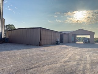 The Frick Grain and Agronomy site facilities are situated on approximately 35+/- acres and represent a rare, large-scale agribusiness operation ready for immediate use.<BR>
The grain system offers an impressive 1,660,000-bushel capacity across six bins. The tower grain dryer operates at 4,000 bu/hr at 5-point moisture removal, ensuring efficient drying capacity for high-volume harvests. The west grain facility features a grain leg capacity of 6,000 bu/hr, while the east grain facility boasts a robust 10,000 bu/hr grain leg capacity. Supporting the drying operation is an 8,000-bushel wet holding bin that feeds directly into the dryer, along with 12,000-bushel overhead load bins. The property also includes an 18,000-gallon LP tank to power operations.<br>
The agronomy infrastructure is equally impressive, featuring over 2,100,000 gallons of liquid fertilizer storage with a covered loadout facility for liquid products. A 500-ton dry fertilizer building with 8 bays provides ample space, complete with blending and loading equipment. The commercial chemical building houses 10 stainless steel tanks with over 30,000 gallons of bulk herbicide storage, equipped with a fully piped, computerized mixing system and covered loadout structure. Additional storage includes a 60' x 80' heated commercial shop building and a 50' x 90' storage building with a tote rack system for chemicals and seed.<br>
The facility enjoys direct access to the Norfolk Southern Railroad, with a large rail siding capable of receiving tanker cars and loading grain onto railcars. A dedicated piping system allows for the direct unloading of tanker cars into the two 1,000,000-gallon liquid tanks. Weighing operations are handled by a heavy-duty 120,000-pound capacity in-ground scale.<br>
As an added income stream, a telecommunications tower located on the west end of the property generates $9,268 in annual income, with an escalator clause providing year-over-year growth.<br>
Please refer to the improvement chart for dates and dimensions of all structures located on the facility.<br>
This is an extremely rare opportunity to acquire this level of grain handling and storage capacity, agronomy infrastructure, and overall square footage - all at a compelling price point. Don't miss your chance to own one of the most well-equipped agricultural facilities available on the market today! - GRAIN FACILITY FOR SALE - 35+/-ACRES IN NOBLE COUNTY, INDIANA
