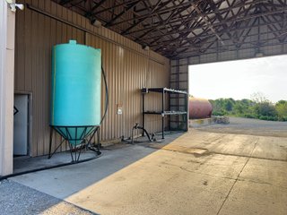 The Frick Grain and Agronomy site facilities are situated on approximately 35+/- acres and represent a rare, large-scale agribusiness operation ready for immediate use.<BR>
The grain system offers an impressive 1,660,000-bushel capacity across six bins. The tower grain dryer operates at 4,000 bu/hr at 5-point moisture removal, ensuring efficient drying capacity for high-volume harvests. The west grain facility features a grain leg capacity of 6,000 bu/hr, while the east grain facility boasts a robust 10,000 bu/hr grain leg capacity. Supporting the drying operation is an 8,000-bushel wet holding bin that feeds directly into the dryer, along with 12,000-bushel overhead load bins. The property also includes an 18,000-gallon LP tank to power operations.<br>
The agronomy infrastructure is equally impressive, featuring over 2,100,000 gallons of liquid fertilizer storage with a covered loadout facility for liquid products. A 500-ton dry fertilizer building with 8 bays provides ample space, complete with blending and loading equipment. The commercial chemical building houses 10 stainless steel tanks with over 30,000 gallons of bulk herbicide storage, equipped with a fully piped, computerized mixing system and covered loadout structure. Additional storage includes a 60' x 80' heated commercial shop building and a 50' x 90' storage building with a tote rack system for chemicals and seed.<br>
The facility enjoys direct access to the Norfolk Southern Railroad, with a large rail siding capable of receiving tanker cars and loading grain onto railcars. A dedicated piping system allows for the direct unloading of tanker cars into the two 1,000,000-gallon liquid tanks. Weighing operations are handled by a heavy-duty 120,000-pound capacity in-ground scale.<br>
As an added income stream, a telecommunications tower located on the west end of the property generates $9,268 in annual income, with an escalator clause providing year-over-year growth.<br>
Please refer to the improvement chart for dates and dimensions of all structures located on the facility.<br>
This is an extremely rare opportunity to acquire this level of grain handling and storage capacity, agronomy infrastructure, and overall square footage - all at a compelling price point. Don't miss your chance to own one of the most well-equipped agricultural facilities available on the market today! - GRAIN FACILITY FOR SALE - 35+/-ACRES IN NOBLE COUNTY, INDIANA